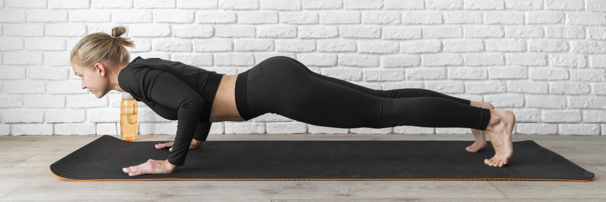 pilates woman plank build strong core balance
