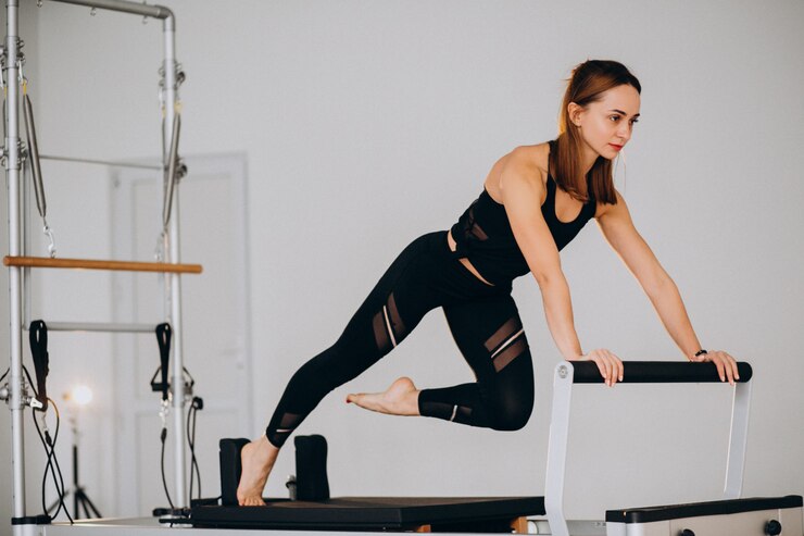 pilates athletes reformer woman exercise concentration