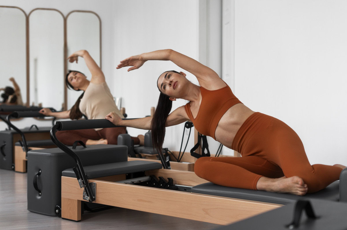 pilates students reformer class all ages