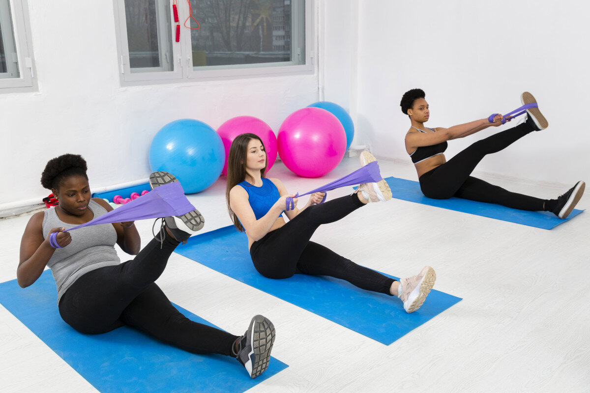 pilates fitness class exercises mat theraband body mind